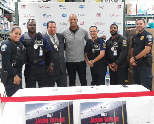 A Meet and Greet With Jason Tayor (Football Player) EGS Team working with Off Duty Police Officers